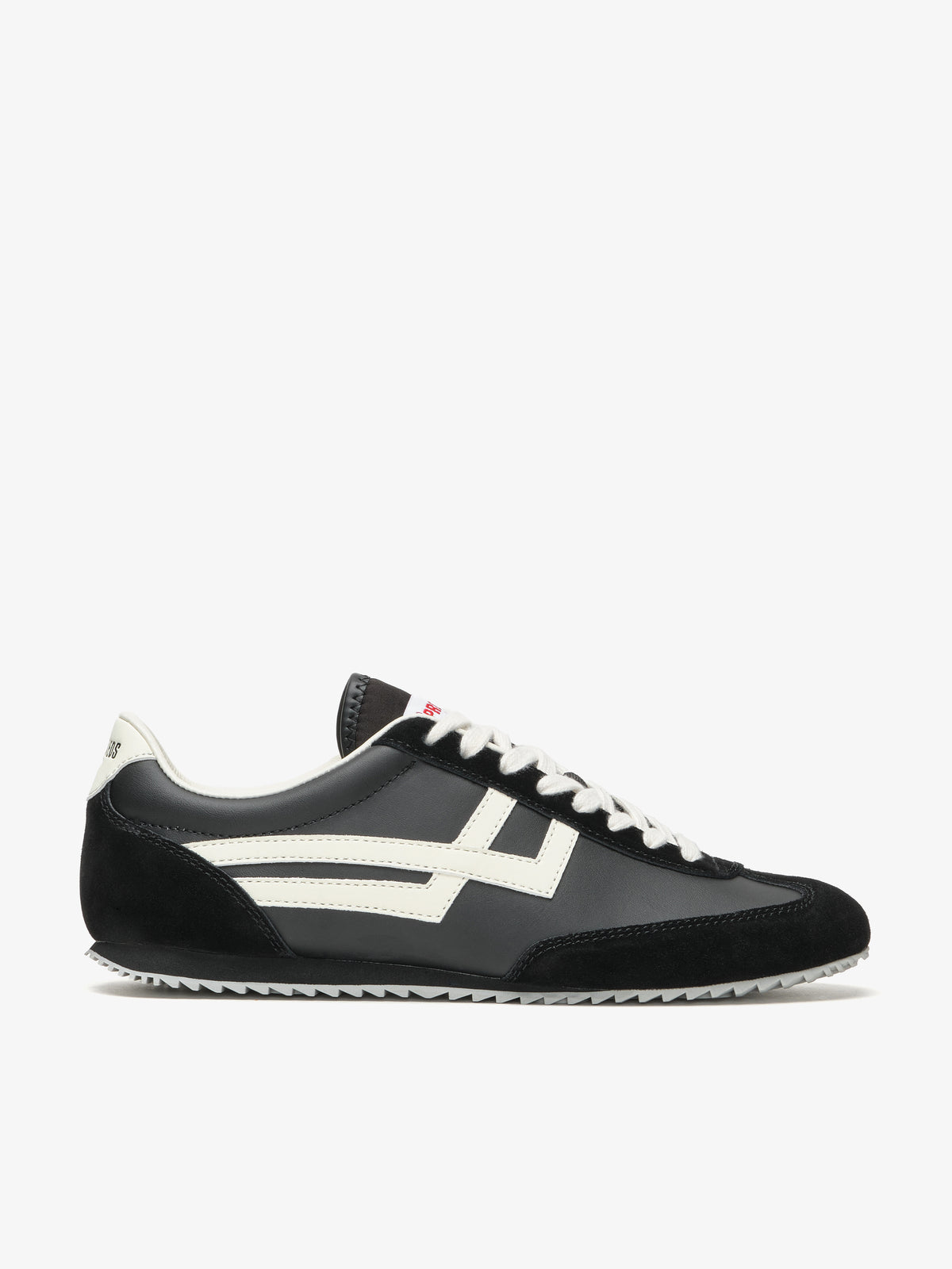 Pro-Keds Racer 77, sneaker nero e avorio, vista laterale con tomaia in pelle e inserti in pelle e suede